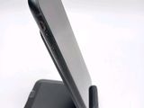 a close up of a cell phone on a stand