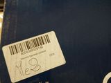 a close up of a blue box with a sticker on it