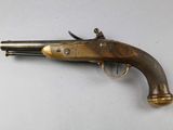 a close up of a gun on a table with a white background