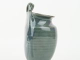 a green vase with a handle on a white background