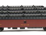 three red and black train cars sitting next to each other on a white surface