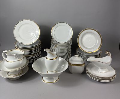 a lot of plates and cups and saucers on the table