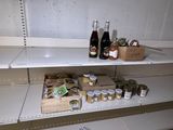 many bottles and containers of food on the shelves