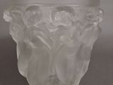 a frosted glass vase sitting on a table