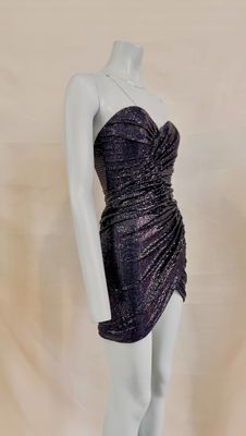 a close up of a mannequin wearing a purple dress on a mannequin