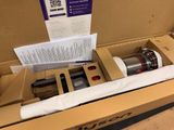 a box that has a vacuum in it on the floor