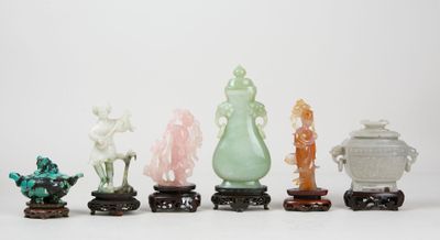 six jade and jade figurines of various shapes and sizes