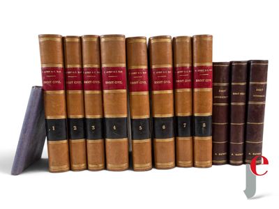 several old books are lined up in a row on a white surface