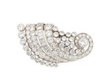 a diamond and white gold broochle