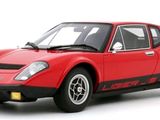 the red sports car is parked on a white surface