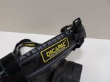a black camera with a yellow and black tag on it
