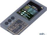 an old game console with buttons and buttons on the screen