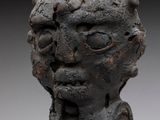 an image of a sculpture of a person with a hand on his chest