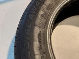 a close up of a tire on a white surface