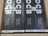 three boxes of black and white books are stacked on top of each other