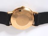 an image of a close up of a watch on a white surface