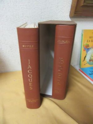 two books sitting on a table next to each other