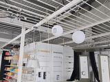a room that has a bunch of lights hanging from the ceiling