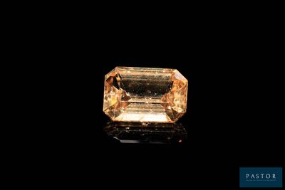 a yellow diamond on a black background