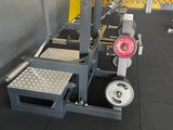 an image of a gym room with weights on the floor