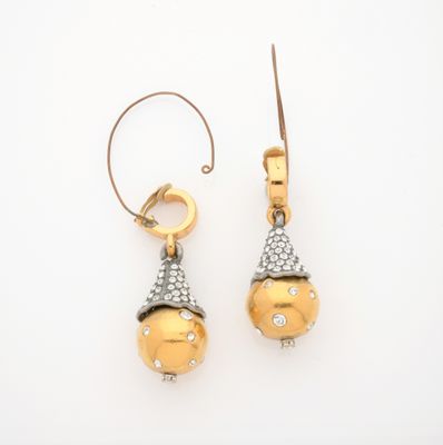 pair of gold and diamond earrings on a white background