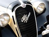 a close up of a black and white car with a chrome grill