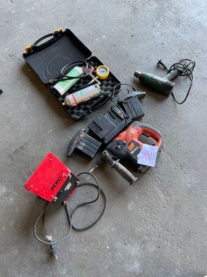 a tool case with tools on the floor next to a pair of scissors