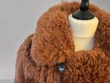 an image of a brown fur coat on a mannequin