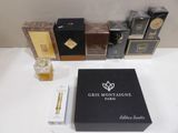 an assortment of perfumes and perfume bottles on a table