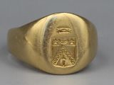 an image of a gold signet ring with a coat of arms on it