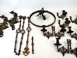 an assortment of antique metal items on a white surface