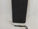 a black leather wallet with a lanyard on the side