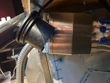 a close up of a metal object with wires attached to it