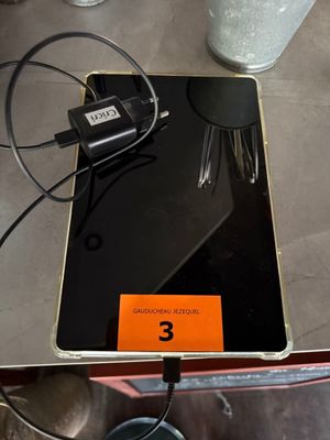 a laptop computer sitting on top of a table