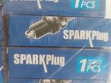 three spark plugs are sitting on top of each other on a table