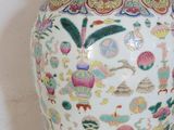 a vase with a lid sitting on a table