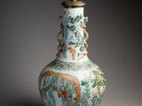 a vase on a wooden stand with a lamp on top