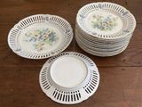 many plates that are sitting on a wooden table