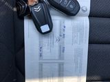 a picture of a car seat with a bunch of keys attached to it