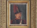portrait of a man in a military uniform in a gold frame