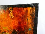 a close up of a painting on a white wall