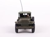 a toy army jeep with a flag on top of it