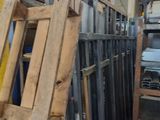 several pieces of wood are stacked on top of each other in a warehouse