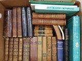 a box full of books that are sitting on the floor