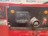 a close up of a red machine with buttons on it