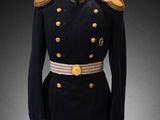 a black uniform with gold buttons on a mannequin base