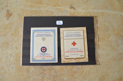 une photo d'un portefeuille sur lequel figure un insigne en forme de croix rouge