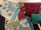 many different types of cloths laid out on a table