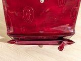 a red purse that is sitting on a table