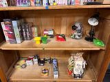 a wooden bookcase with many different items on top of it